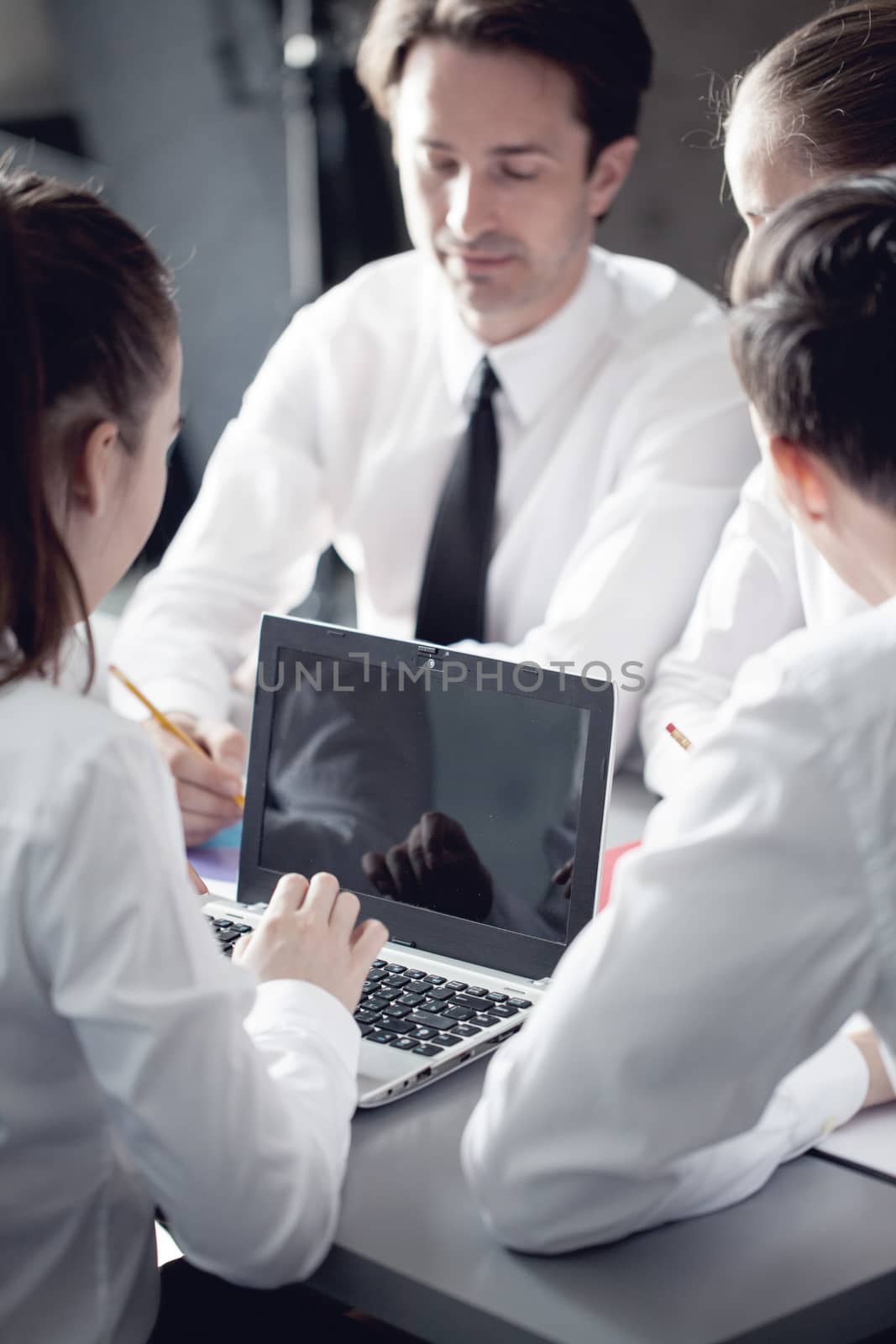 Group of business people working together at meeting in office