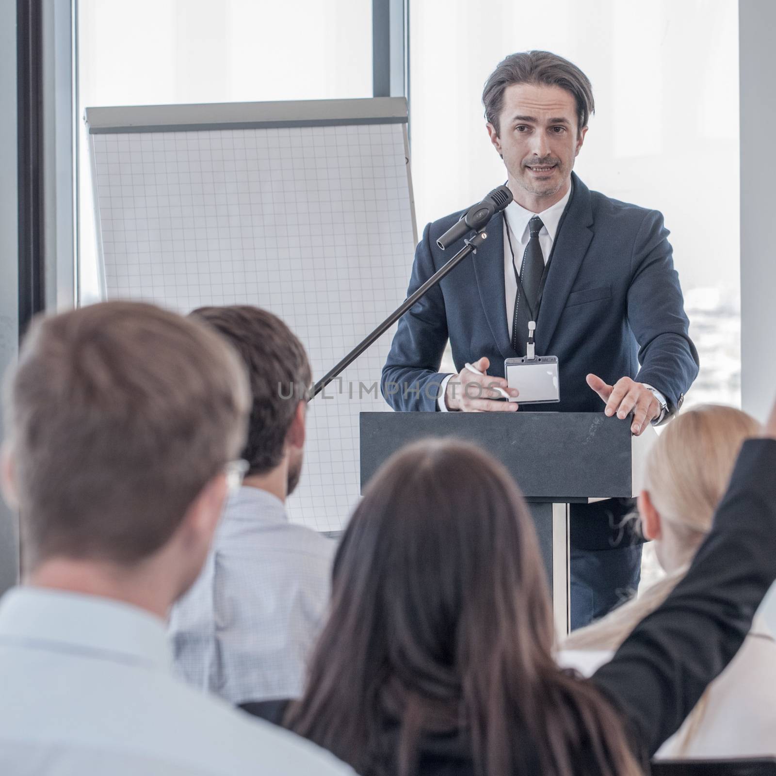 Speaker at presentation to audience by ALotOfPeople