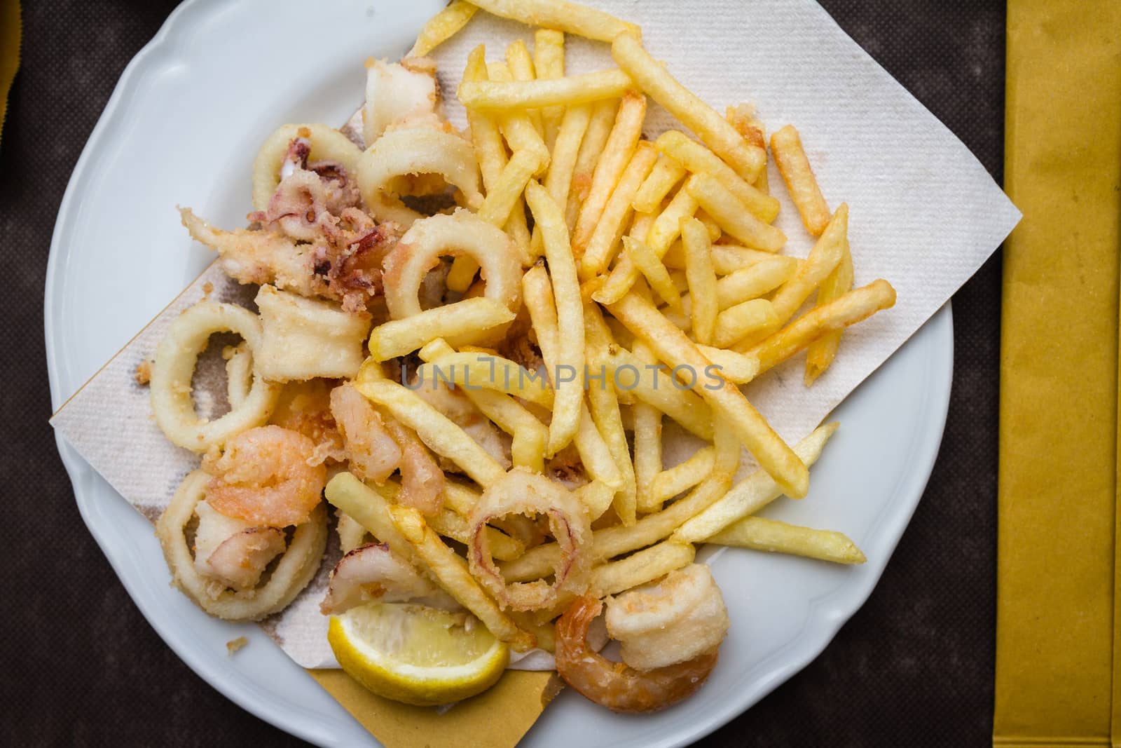 mixed fried fish, with squid, blue fish, chips and lemon