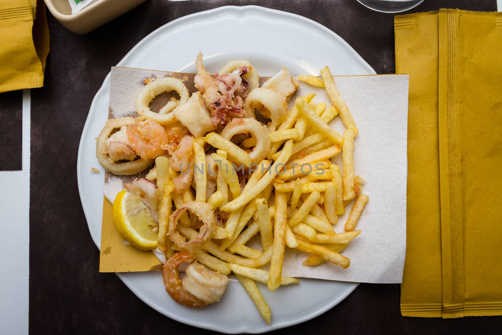 mixed fried fish, with squid, blue fish, chips and lemon