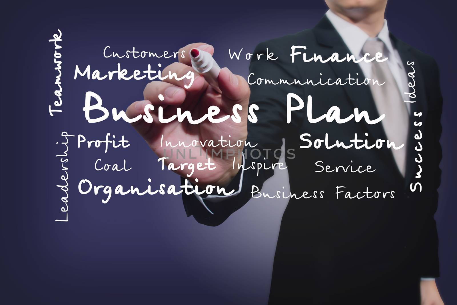businessman with pen writing on the screen.Business Factors


