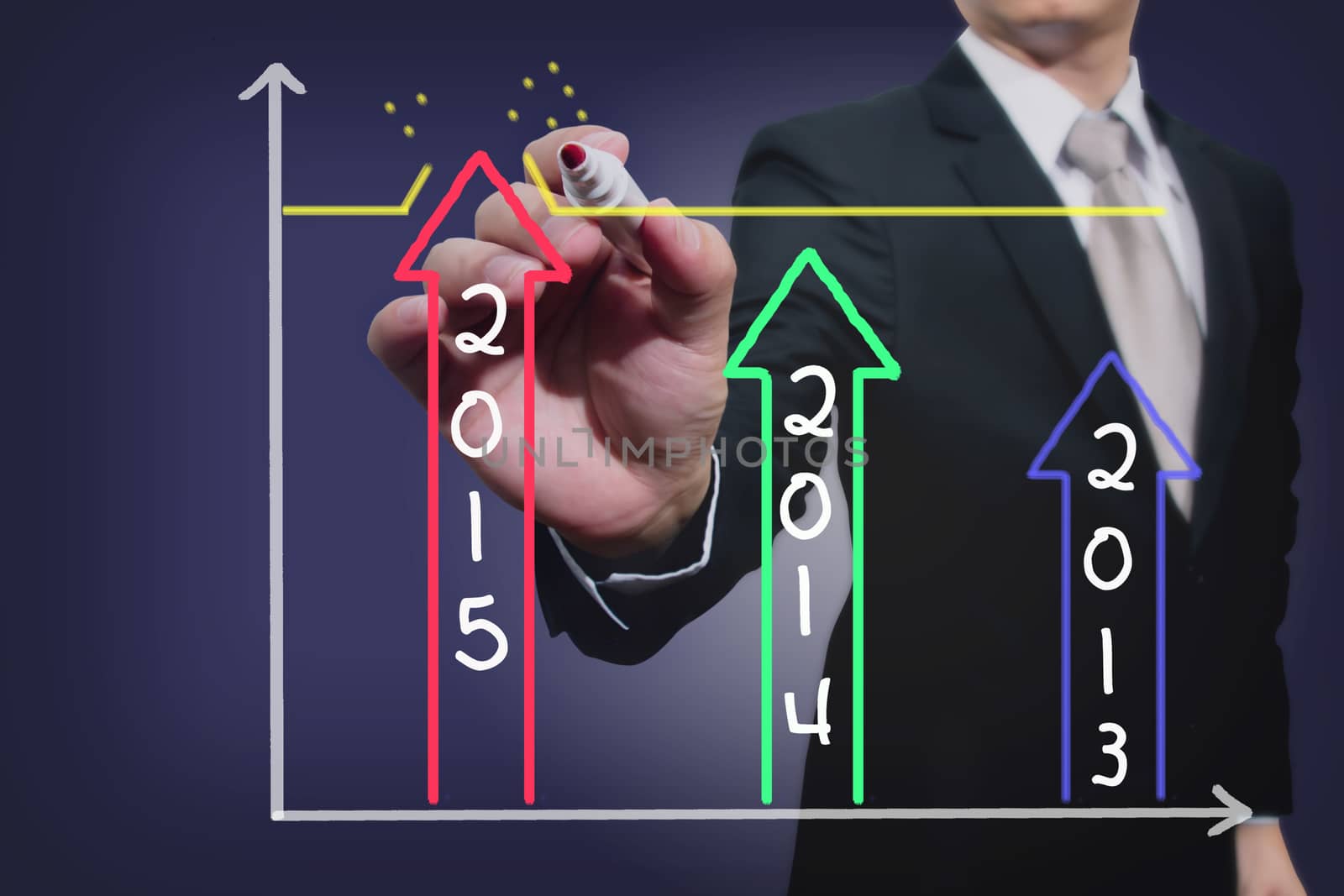 businessman drawing over target achievement graph