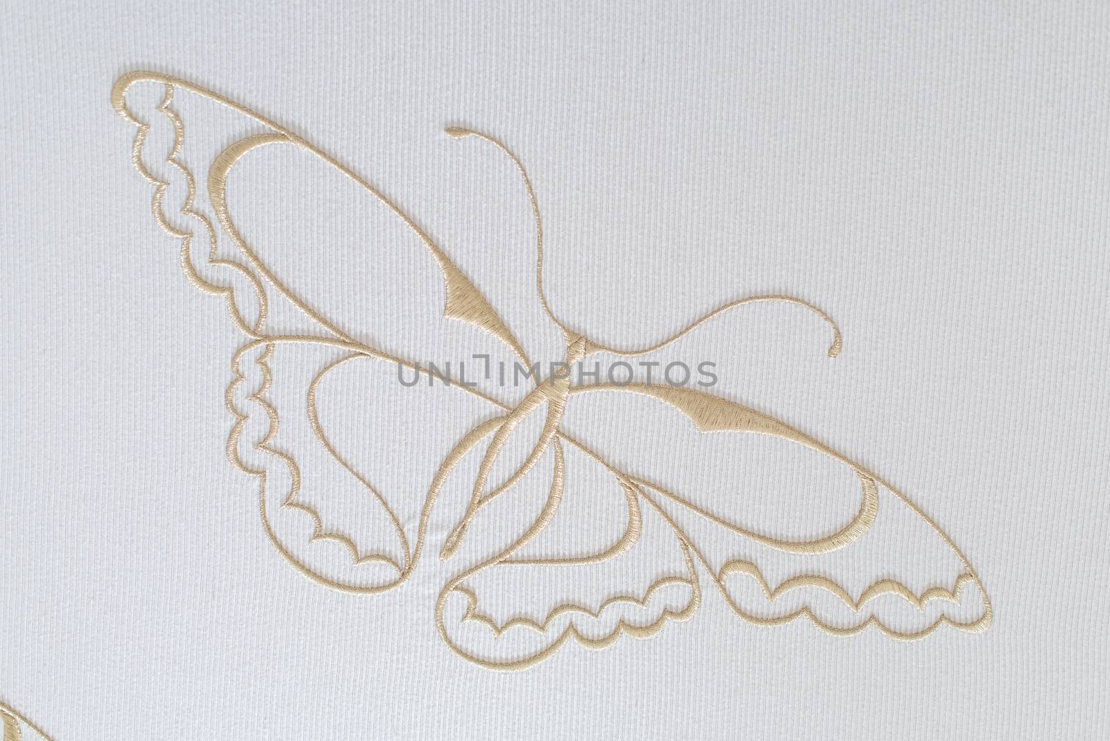 Embroidery butterfly on cotton background