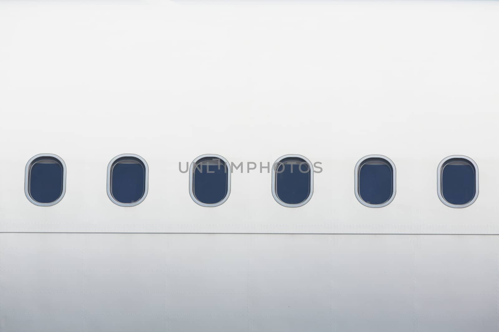 Windows of the white airplane - copy space
