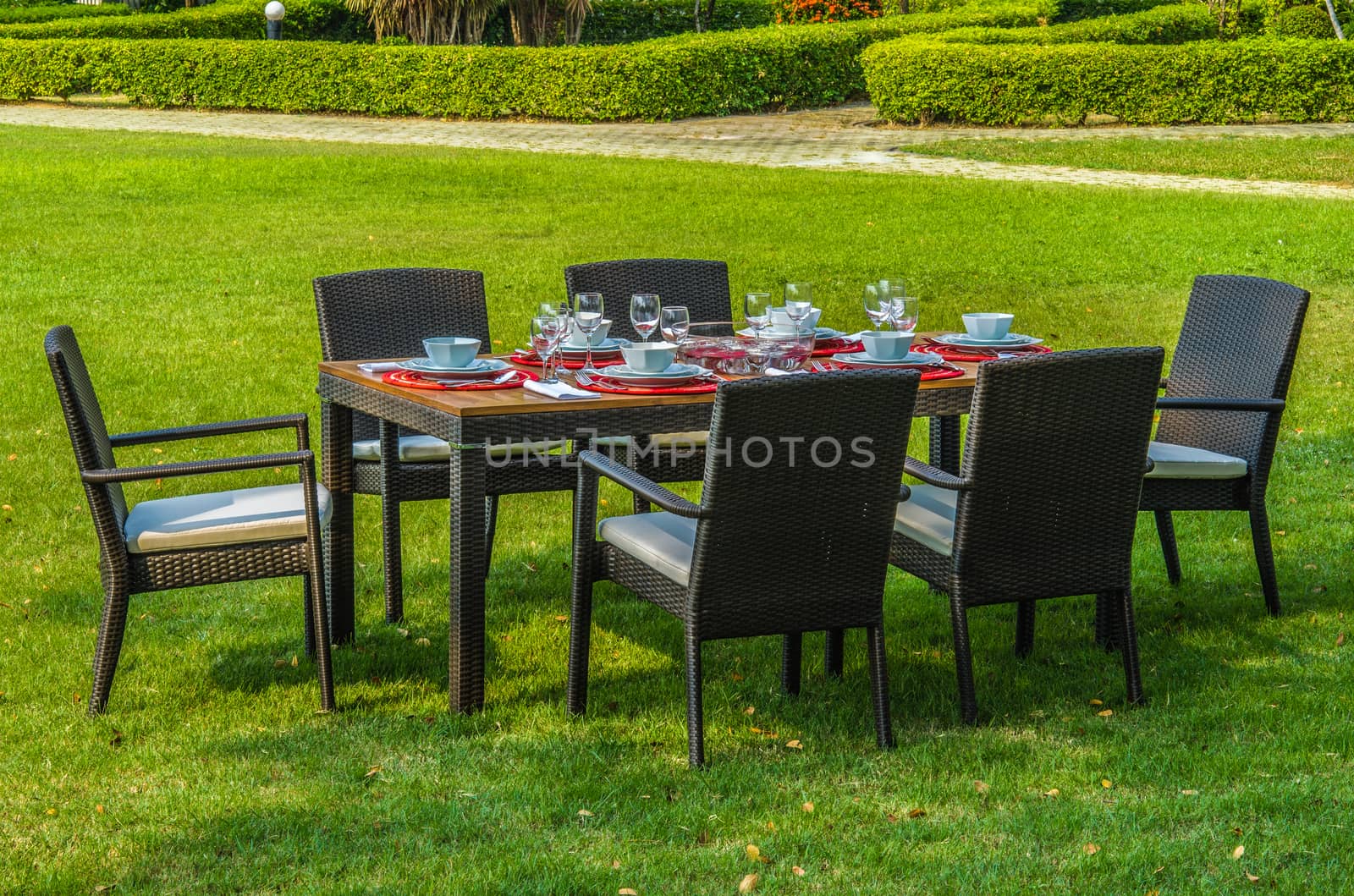 Water resistant outdoor rattan furniture, table, chairs and outdoor cushions