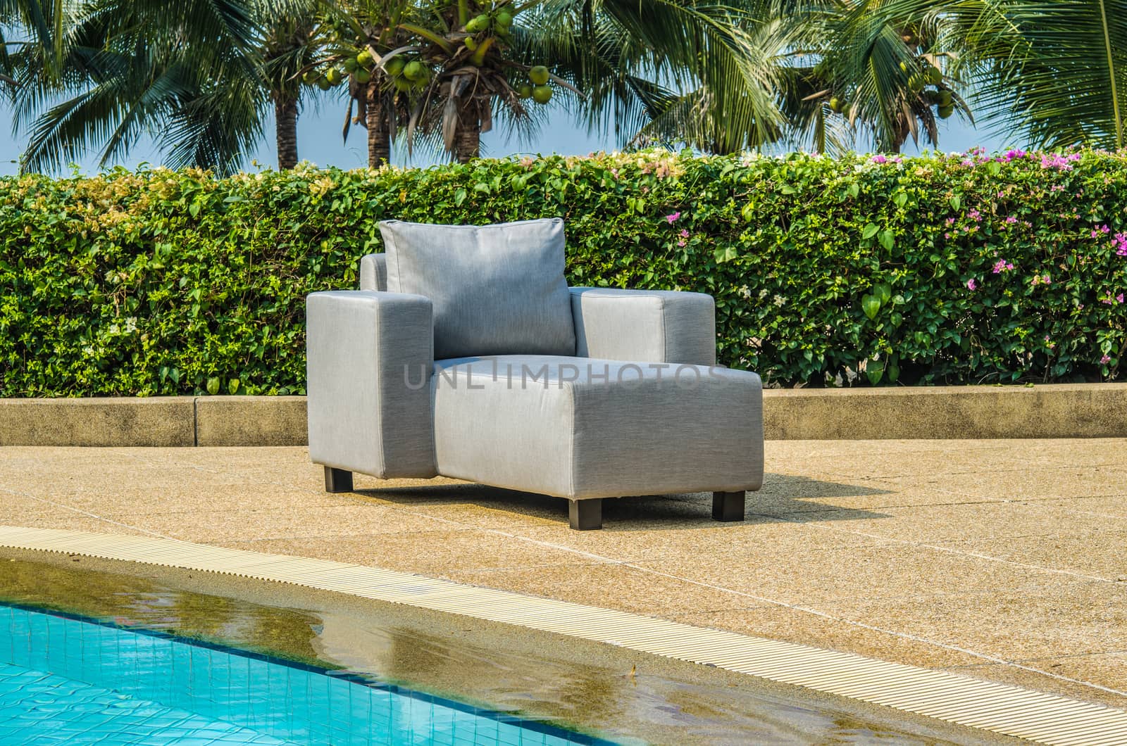 Water resistant outdoor sofa chair with cushions and pillows