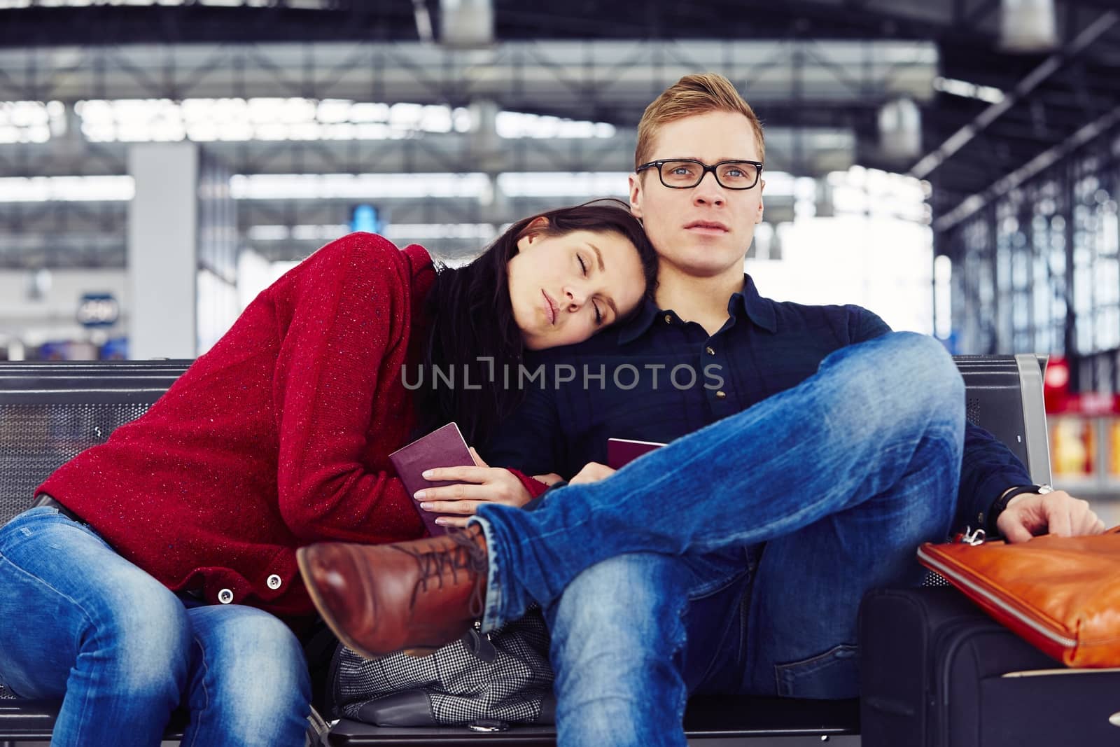 Couple waiting for flight at the airport