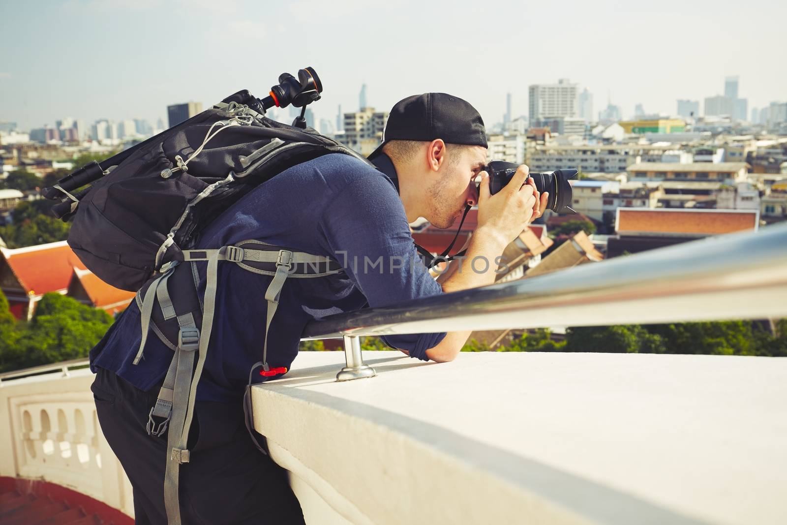 Young photographer is taking photos in Bangkok, Thailand