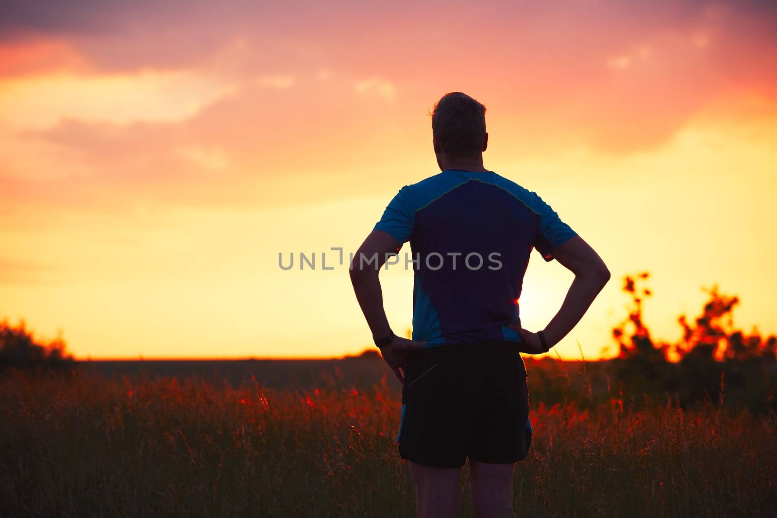 Pensive runner at the sunset by Chalabala