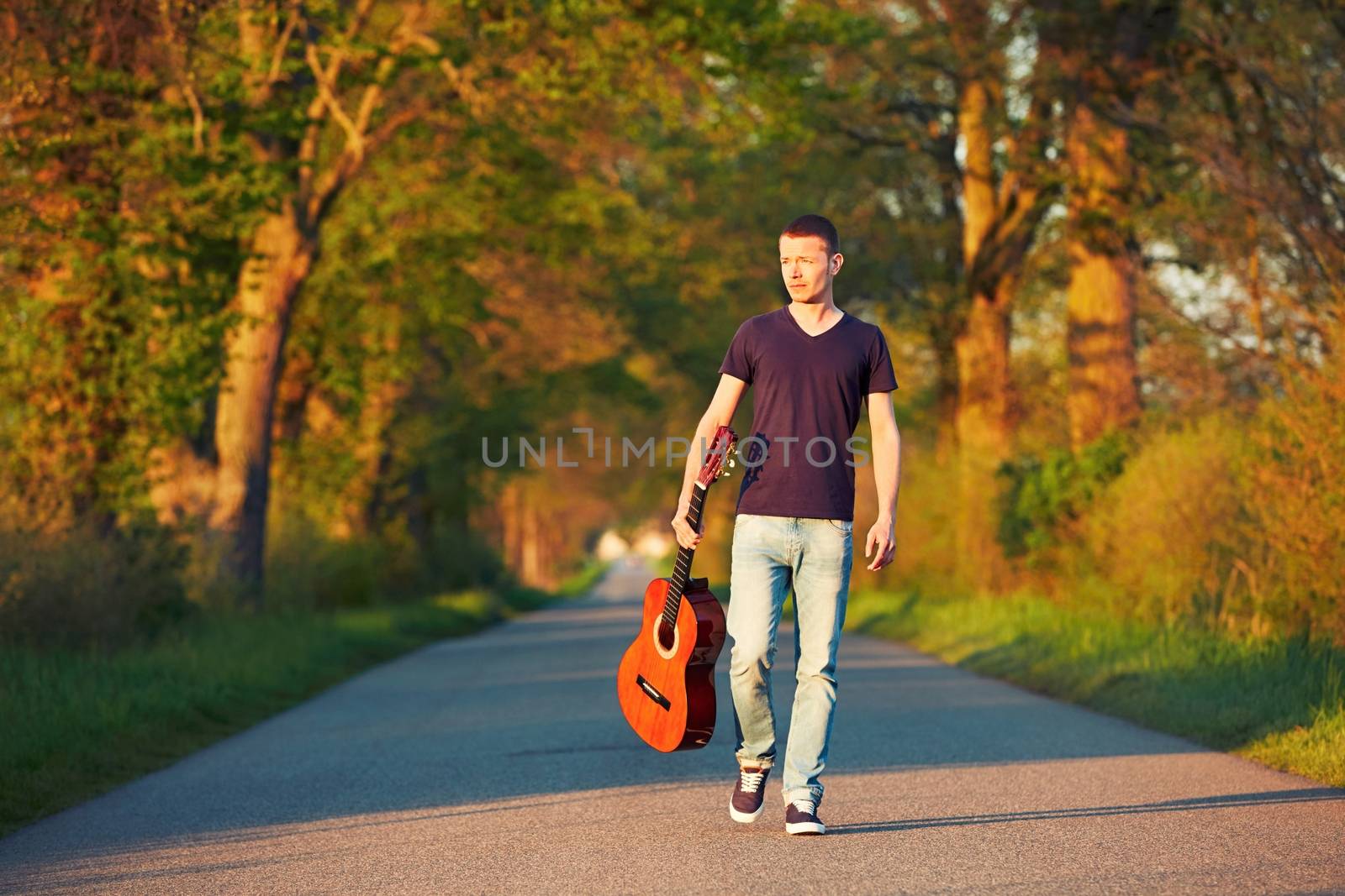 Handsome young man is enjoying sunny day