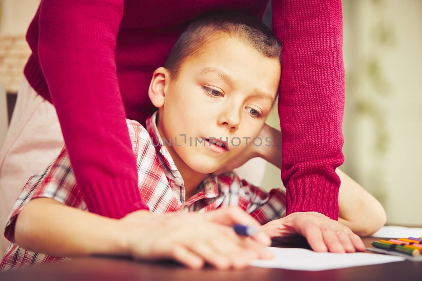 Boy is doing homework  by Chalabala