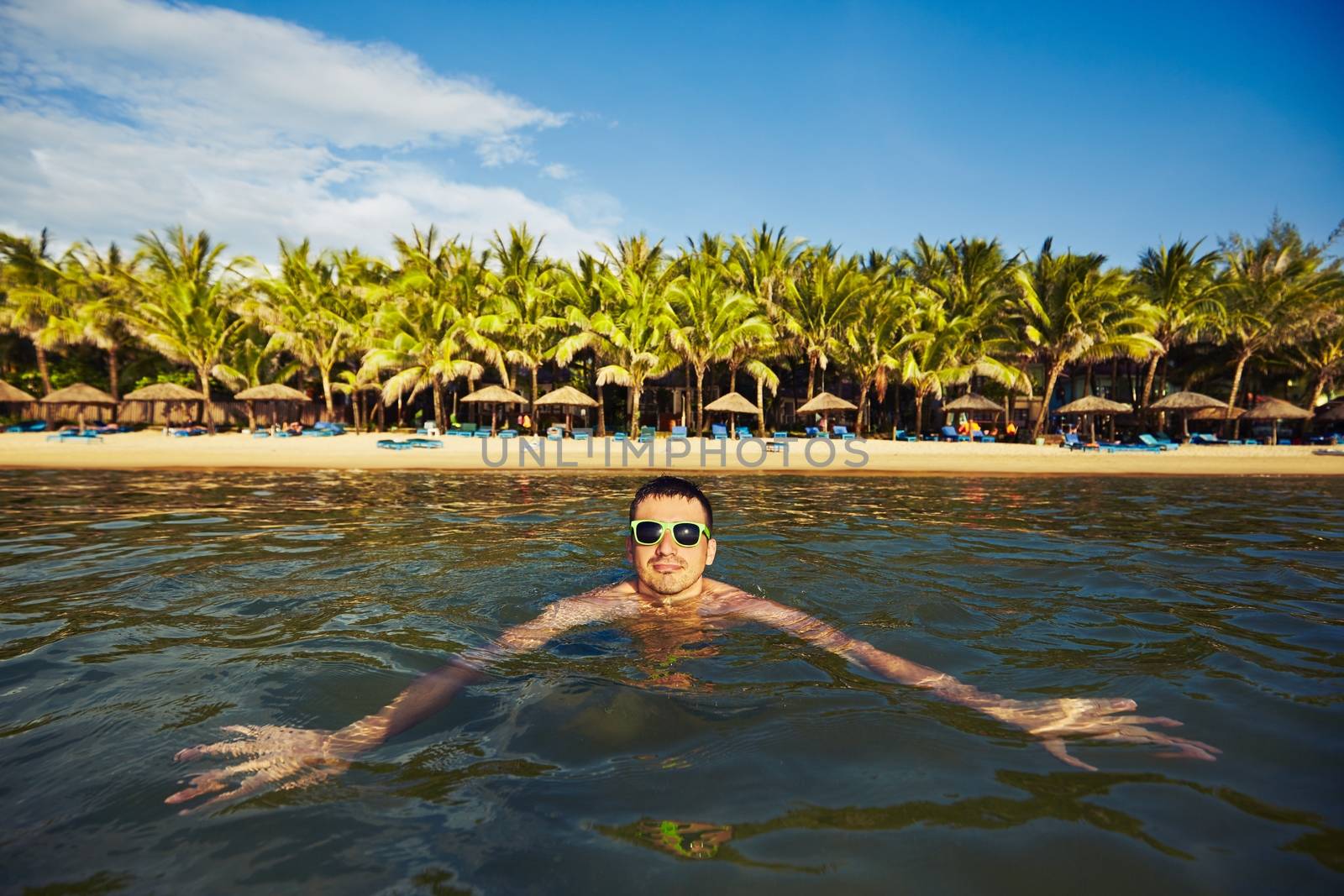 Young tourist is swimming in the sea - Vietnam