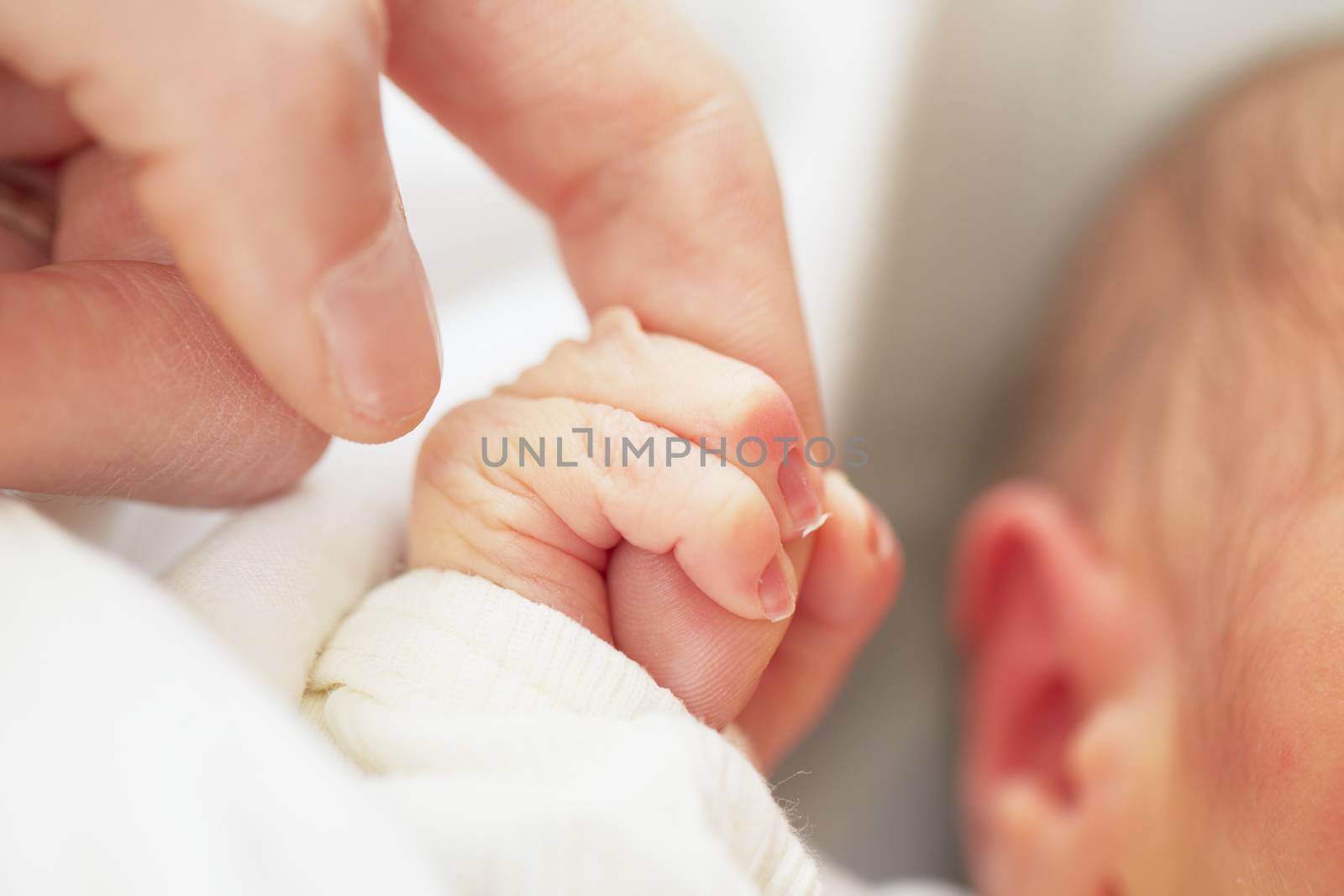 Newborn baby with father - selective focus