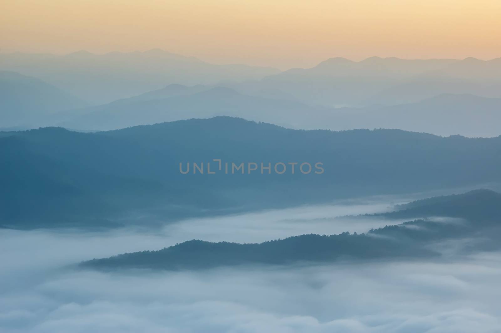 Beautiful morning with fog between hills at Doi Samer Dao in Si Nan National Park , High mountain in Nan province, Thailand