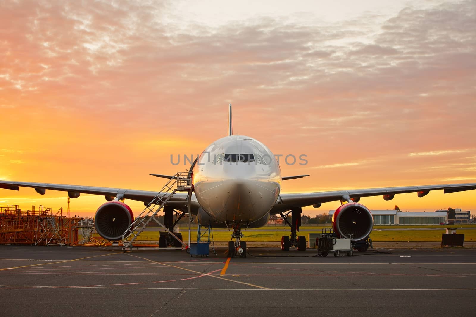 Aircraft maintenance  - large aircraft at the beautiful sunrise