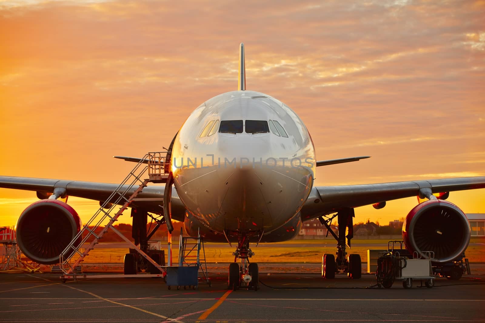 Aircraft service - large aircraft at the beautiful sunrise