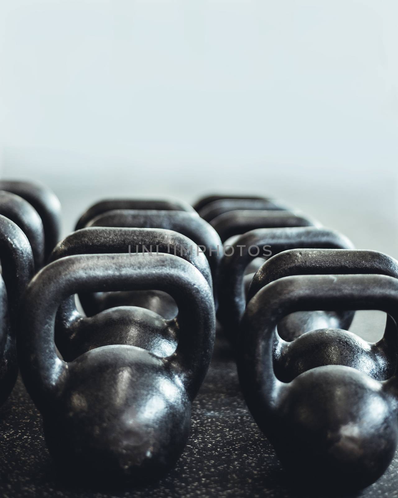 Kettlebells organized and put away at the gym.