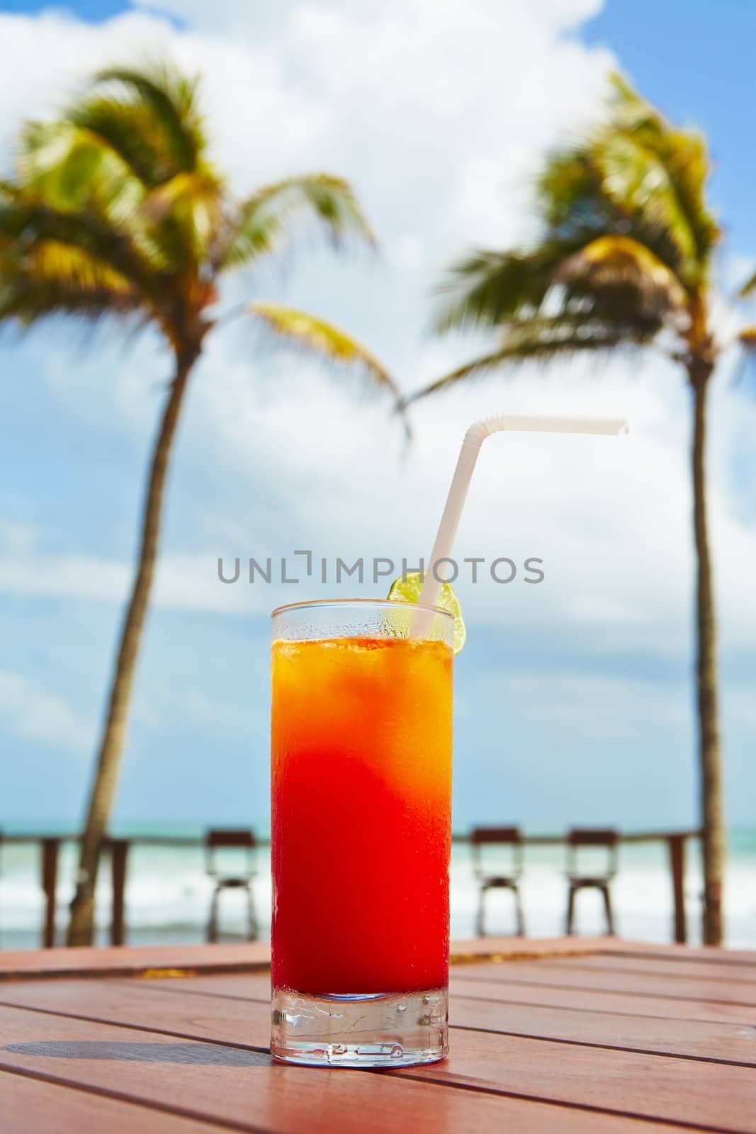 Cold Tequila Sunrise cocktail on the beach