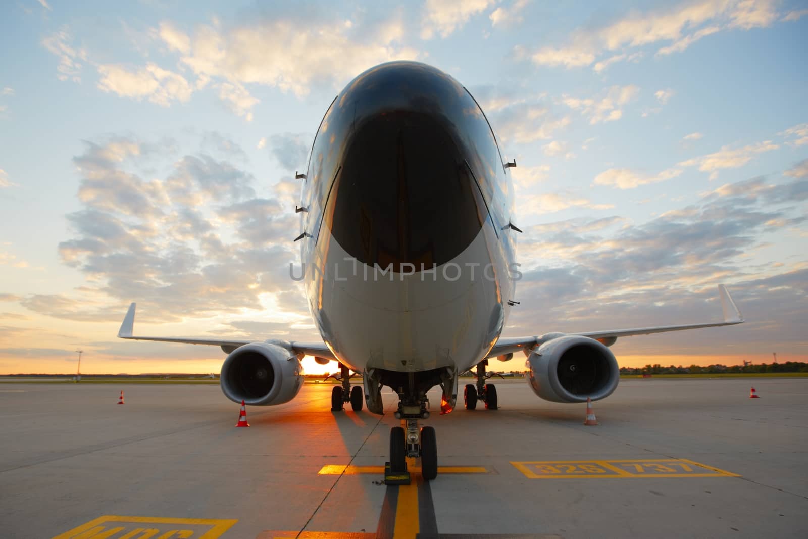 Airplane at the sunset - back lit 
