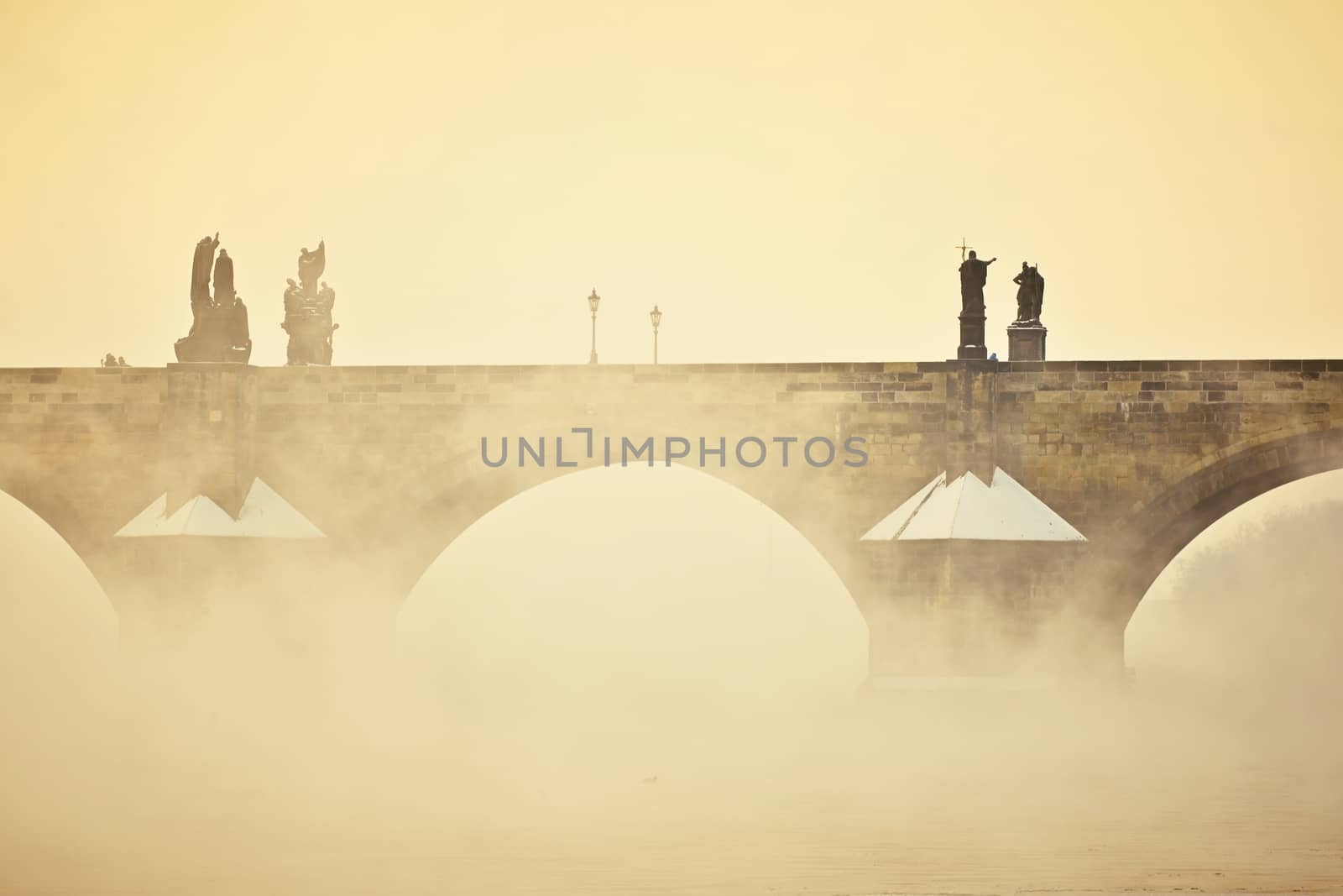 Charles bridge in morning fog, Prague, Czech Republic