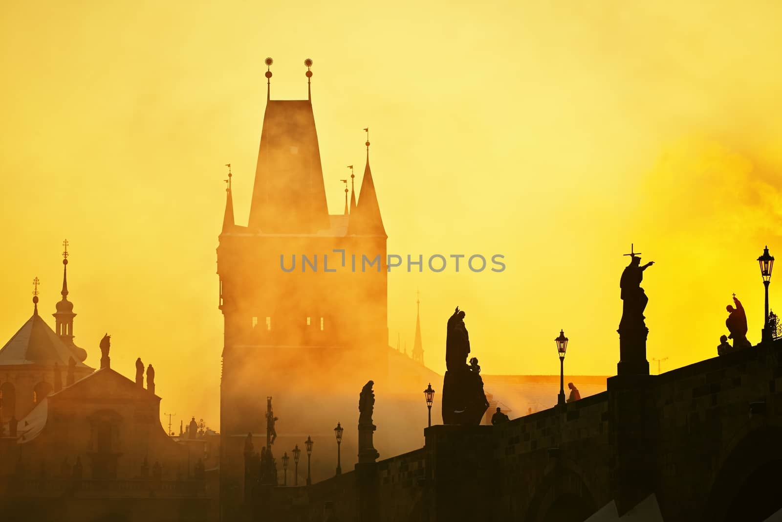 Mystery fog in sunrise. Charles bridge in Prague, Czech Republic. 