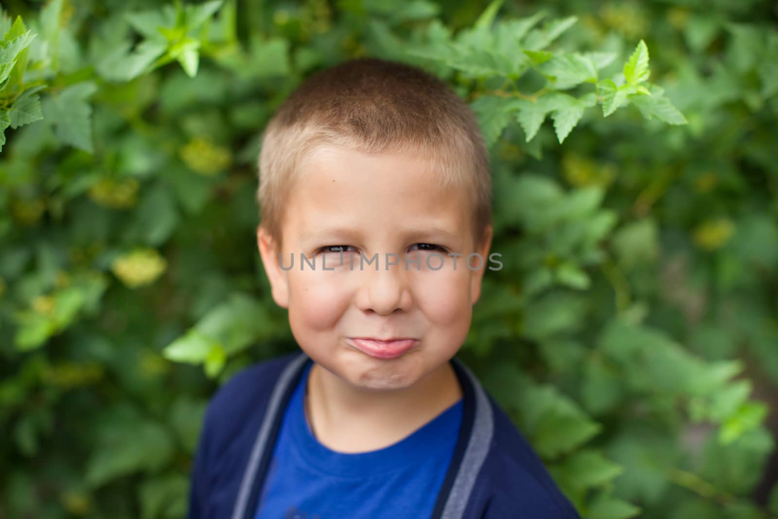 Portrait of a boy close up in nature