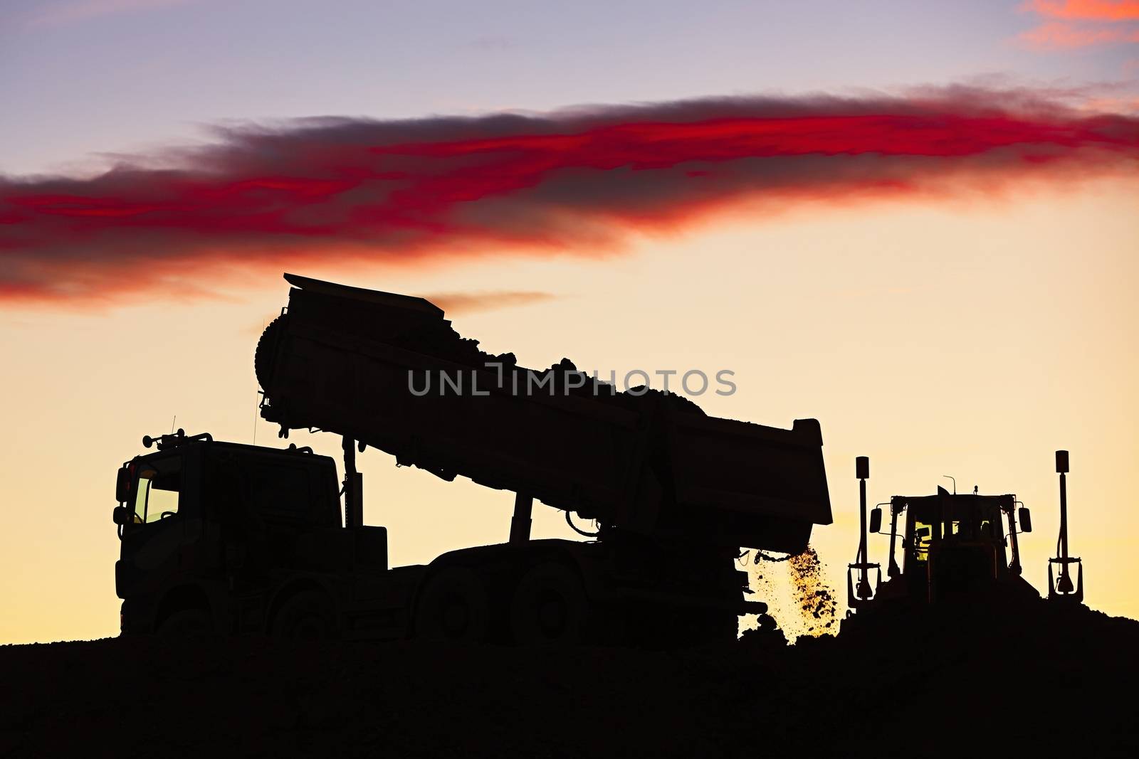 Silhouette of the truck in the building site