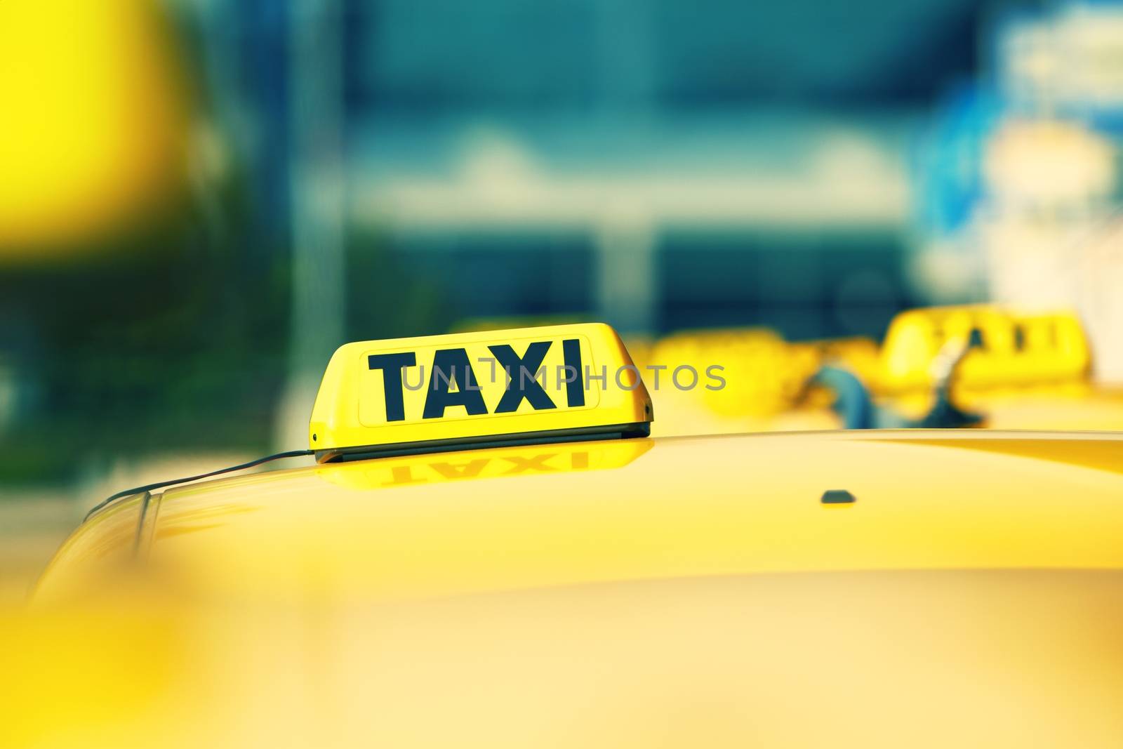Taxi cars are waiting in row on the street - selective focus