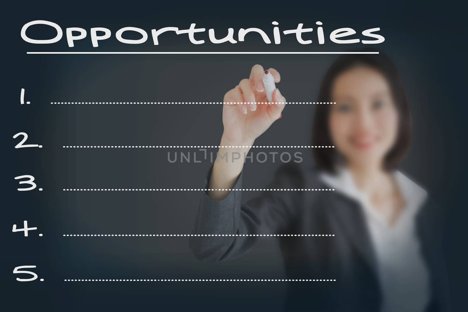 Beautiful businesswoman writing list of business weakness opportunities