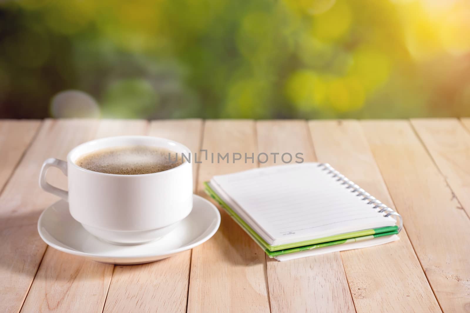 warm cup of coffee on nature background.