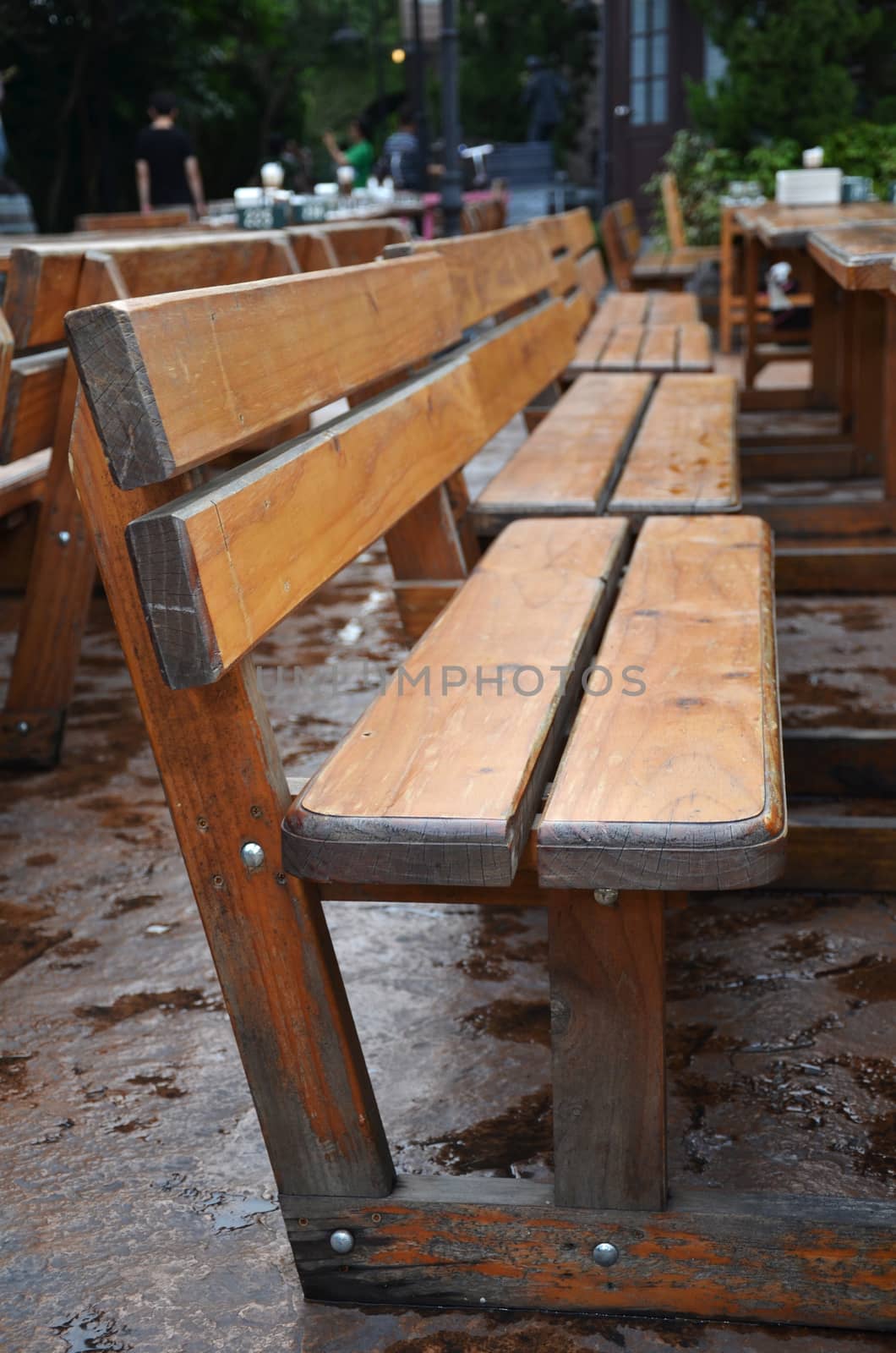 Wooden long bench in outdoor dinning area