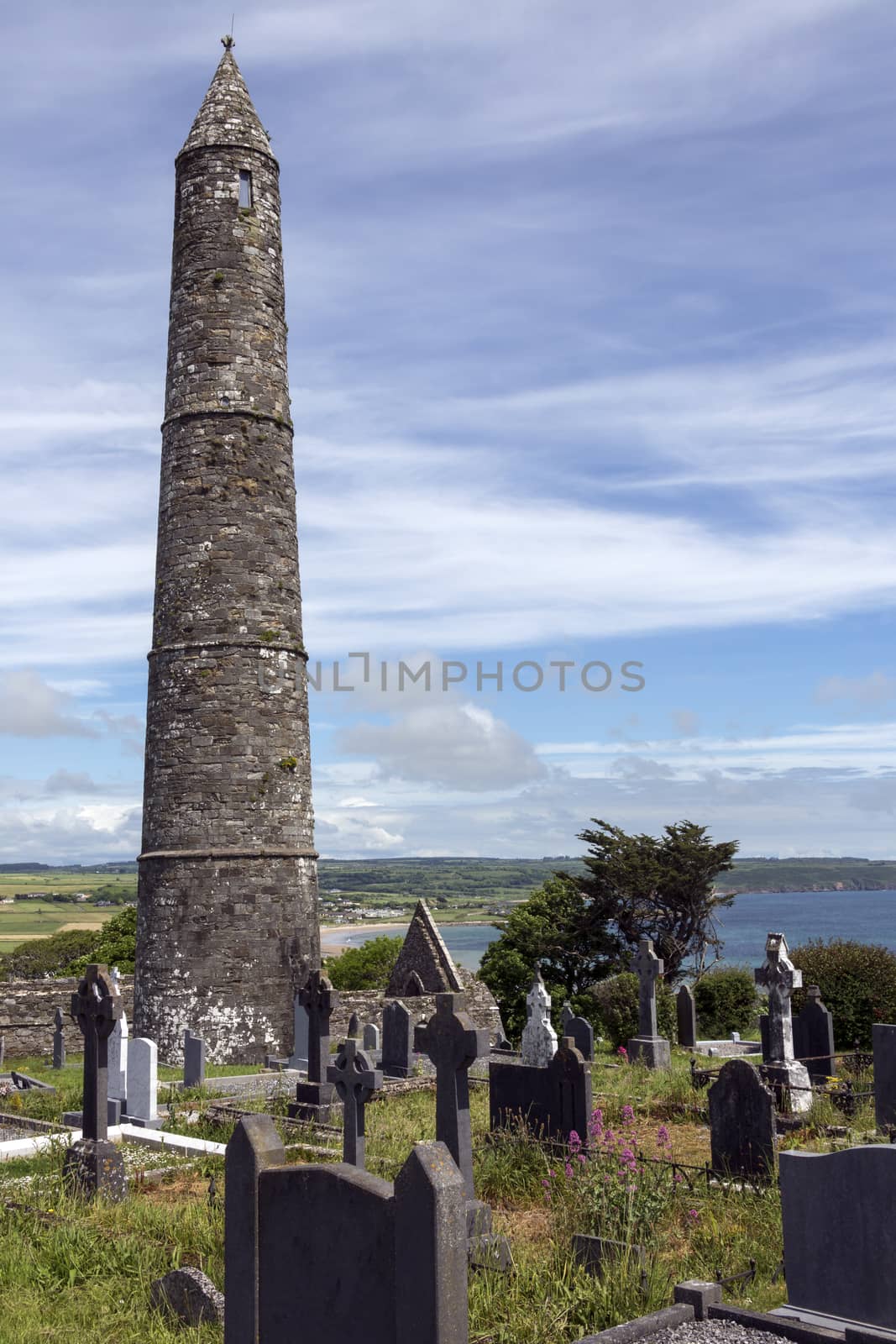 The ruins of Ardmore Cathedral and round tower, County Waterford in the Republic of Ireland. On a hill above the village of Ardmore is a well-preserved 30m, 12th-century round tower and the ruins of a Cathedral dating from the 13th century.