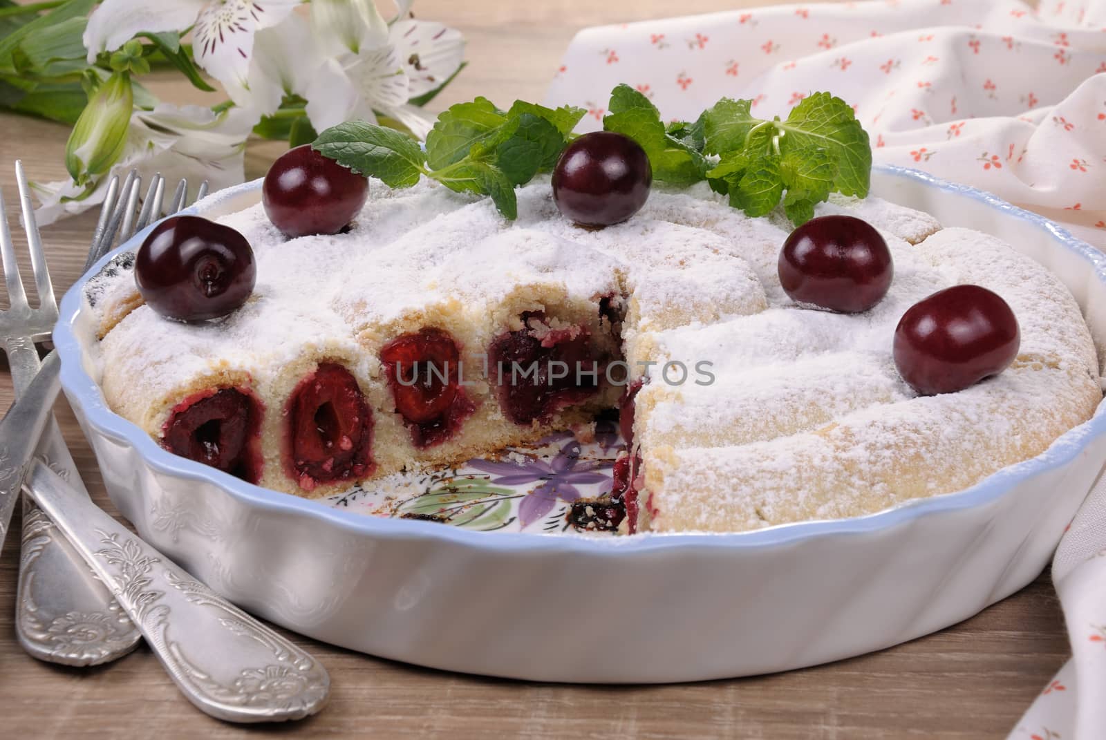 cherry pie pastry cut side under sugar powder