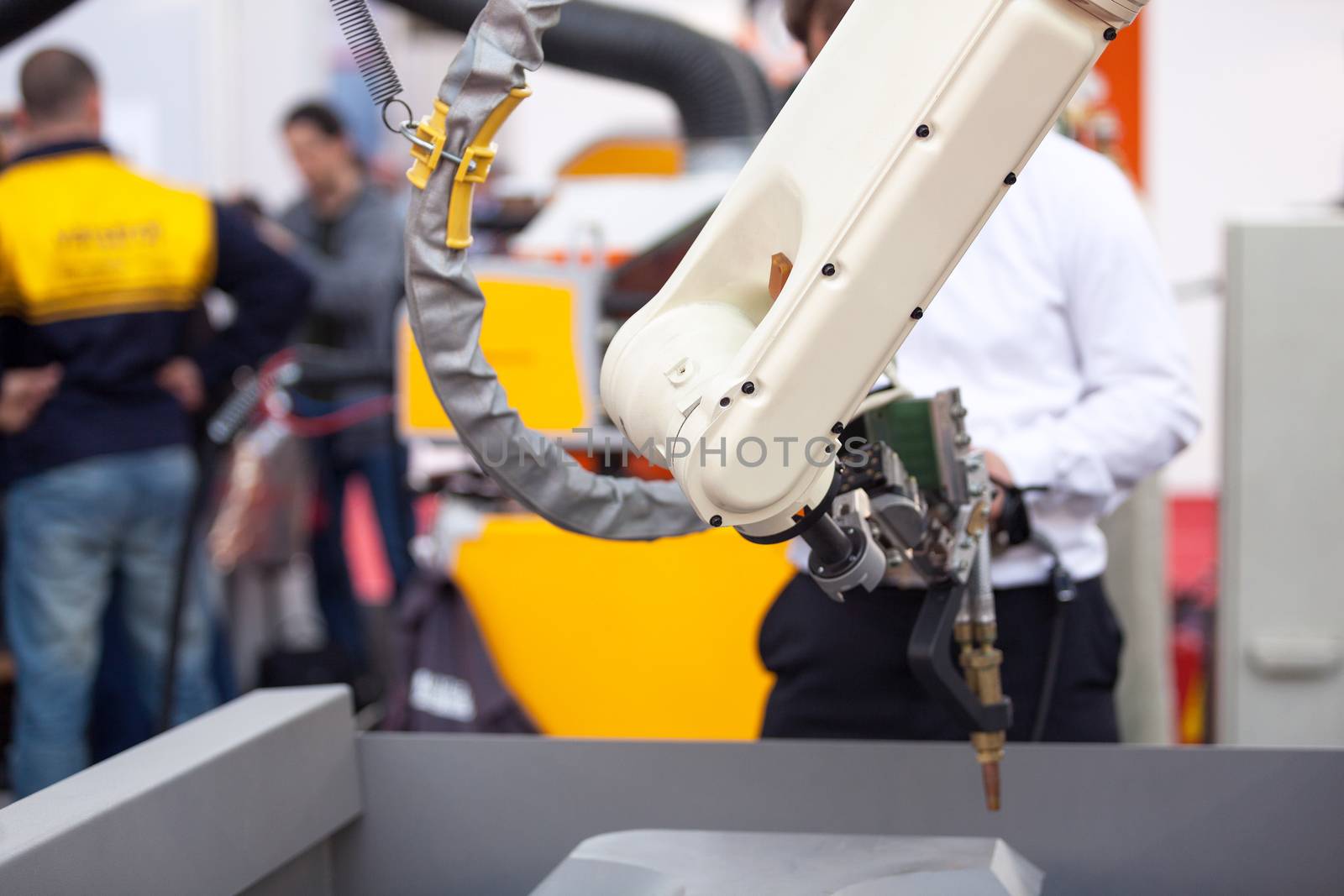 Industrial robot arm by wellphoto