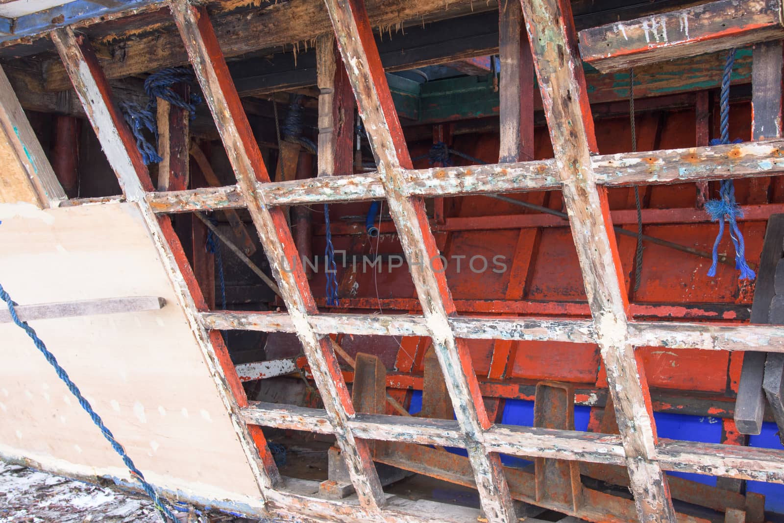 Filipino fishing vessel being repaired with marine plywood at a shipyard in The Philippines.