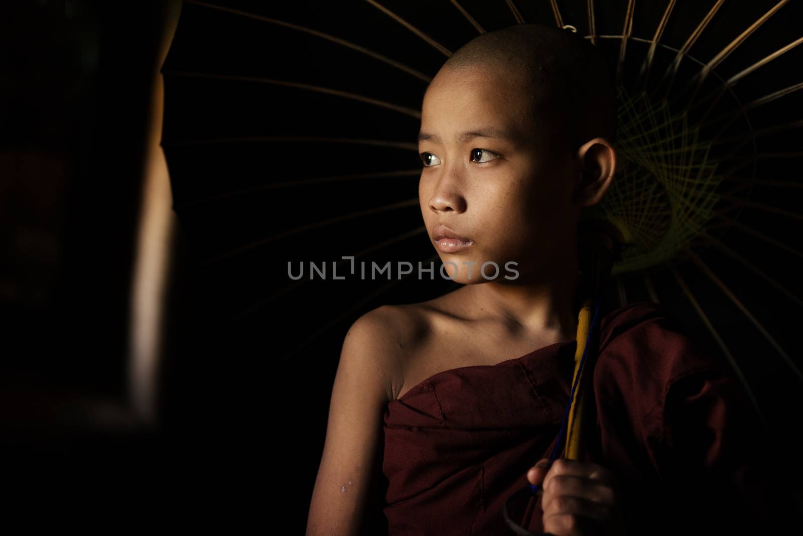 Portrait of young novice monks walking thru a Buddhist temple, Bagan, Myanmar.