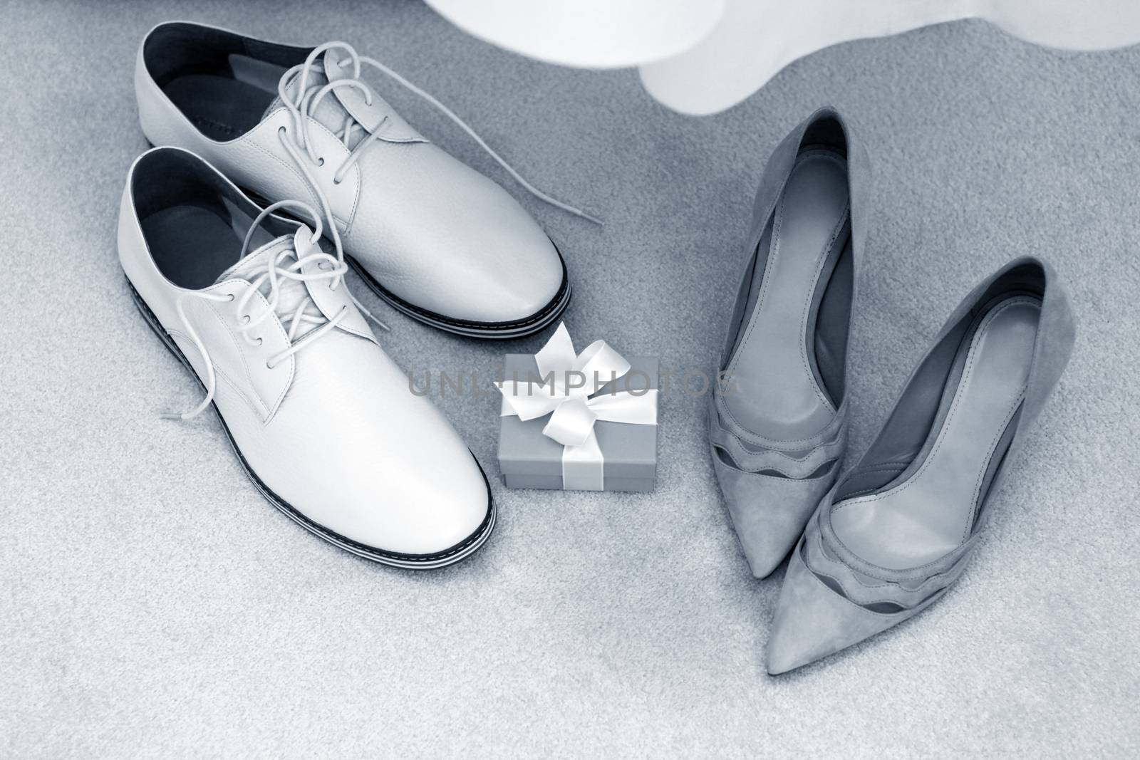 White shoes groom and beautiful bride's shoes
