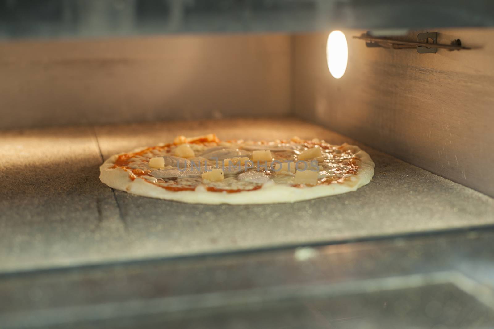 Pizza baking in the oven. High resolution