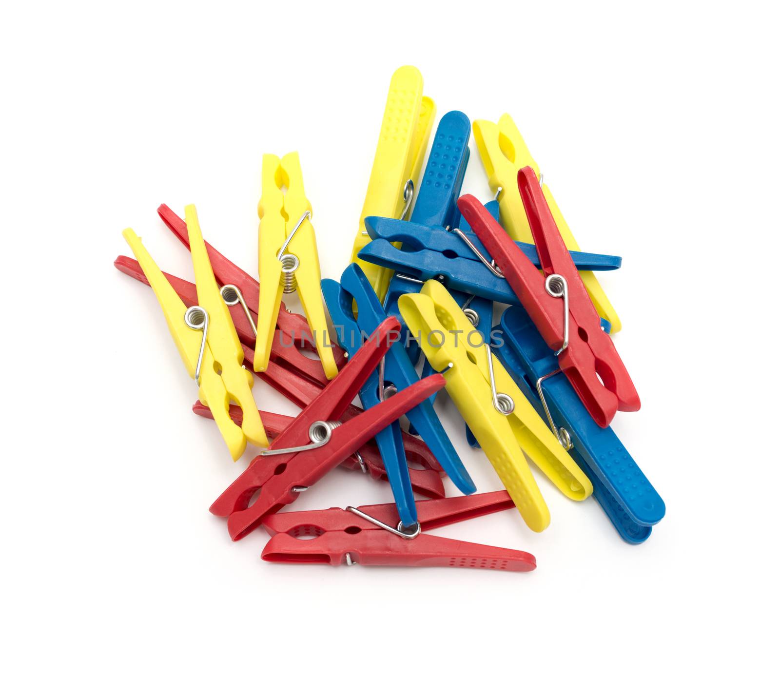 Multicoloured plastic clothes pegs on a white background by DNKSTUDIO