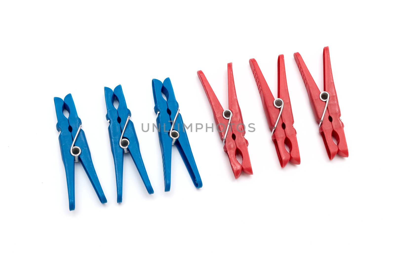 plastic clothes pegs on a white background by DNKSTUDIO