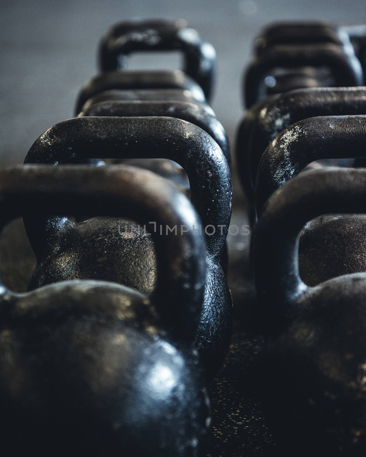 Kettlebells organized and put away at the gym.