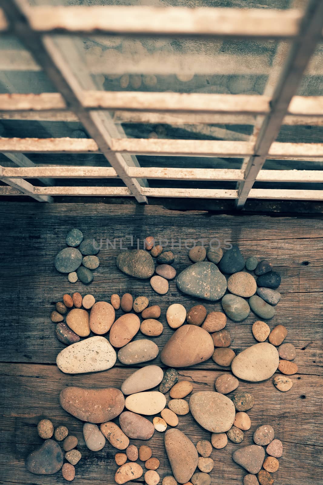 Abstract cute concept on wood backgroup from pebbles, amazing arranged boulder to family of footprint, awesome shape from pebblestone