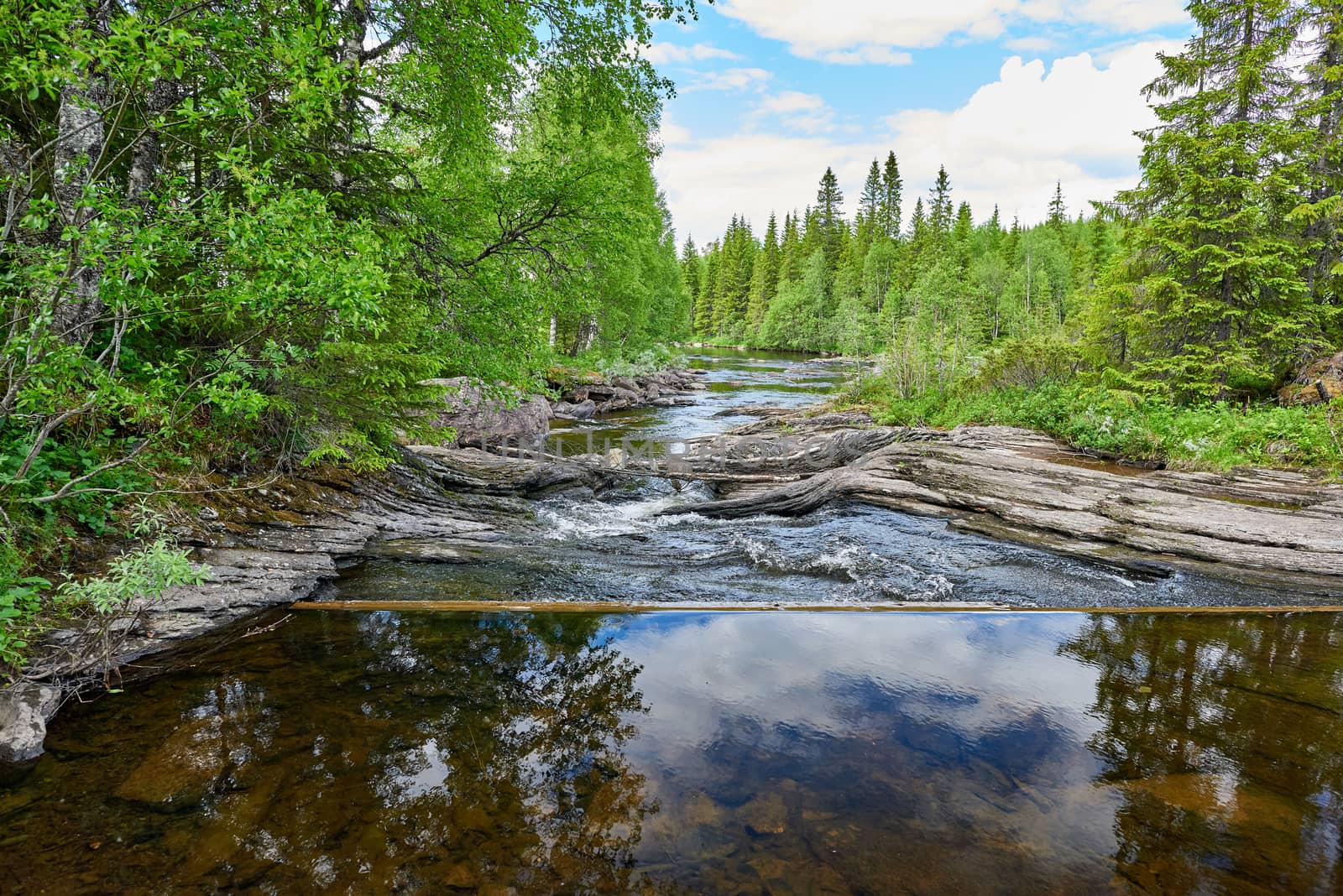 View of a small dam and a river.