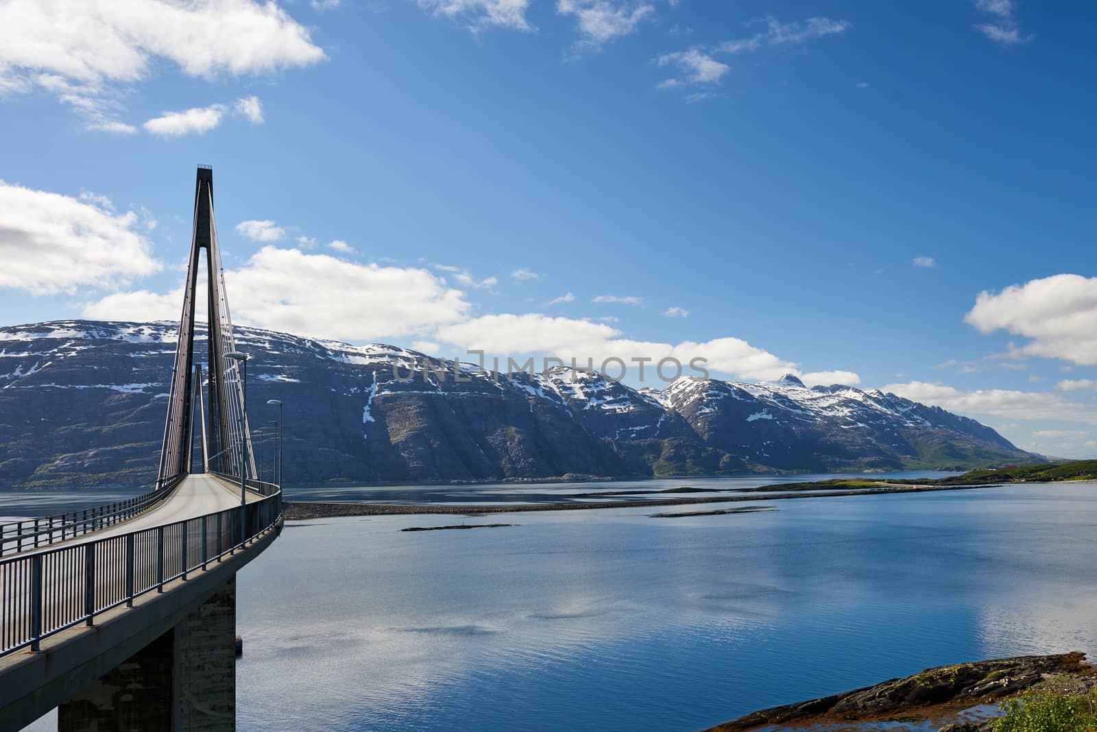 View of Helgeland Bridge and the seven sisters mountain range in Sandnessjøen, Norway.