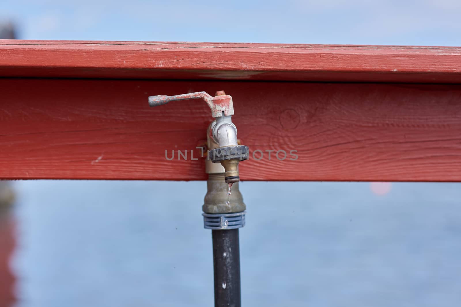 Water dripping from outdoor faucet.