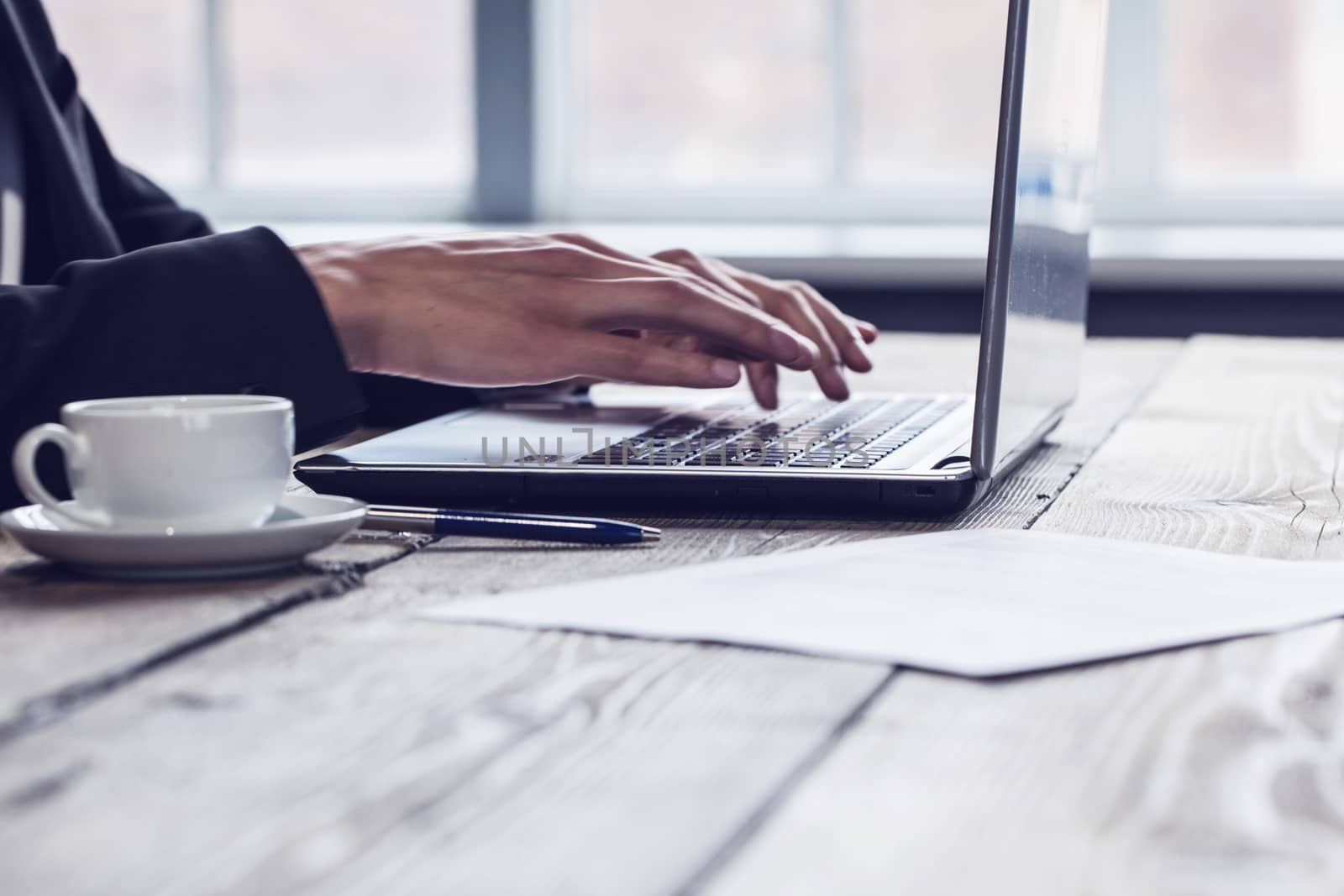 Business man working with laptop computer and financial documents in office