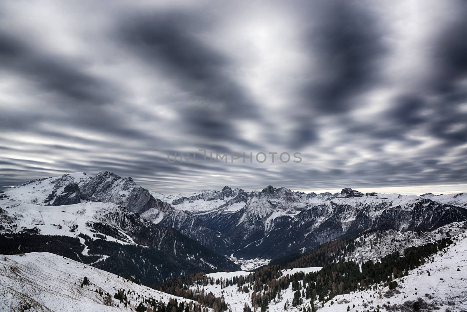 Landscape of the italian alps in a winter morning with amazing cloudy sky, Dolomiti - Italy