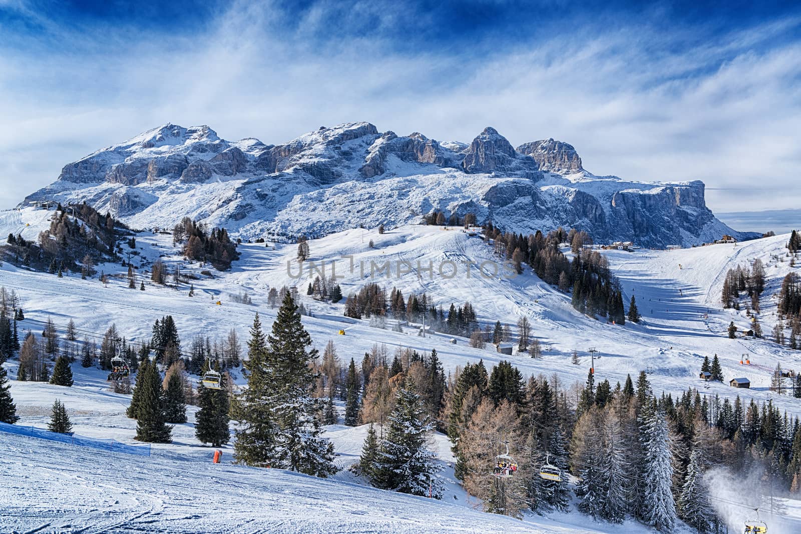 Landscape of the italian alps in a winter morning with clouds at the horizon, Dolomites Alta Badia