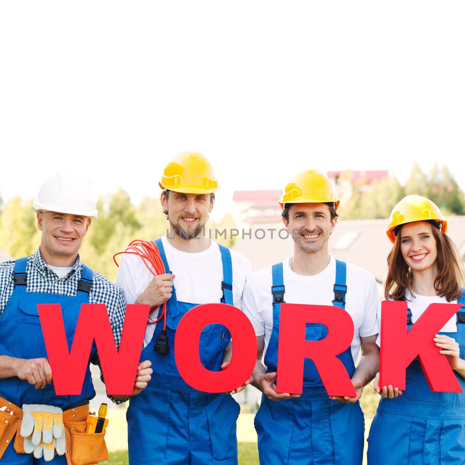 Team of happy workers with work letters and tools