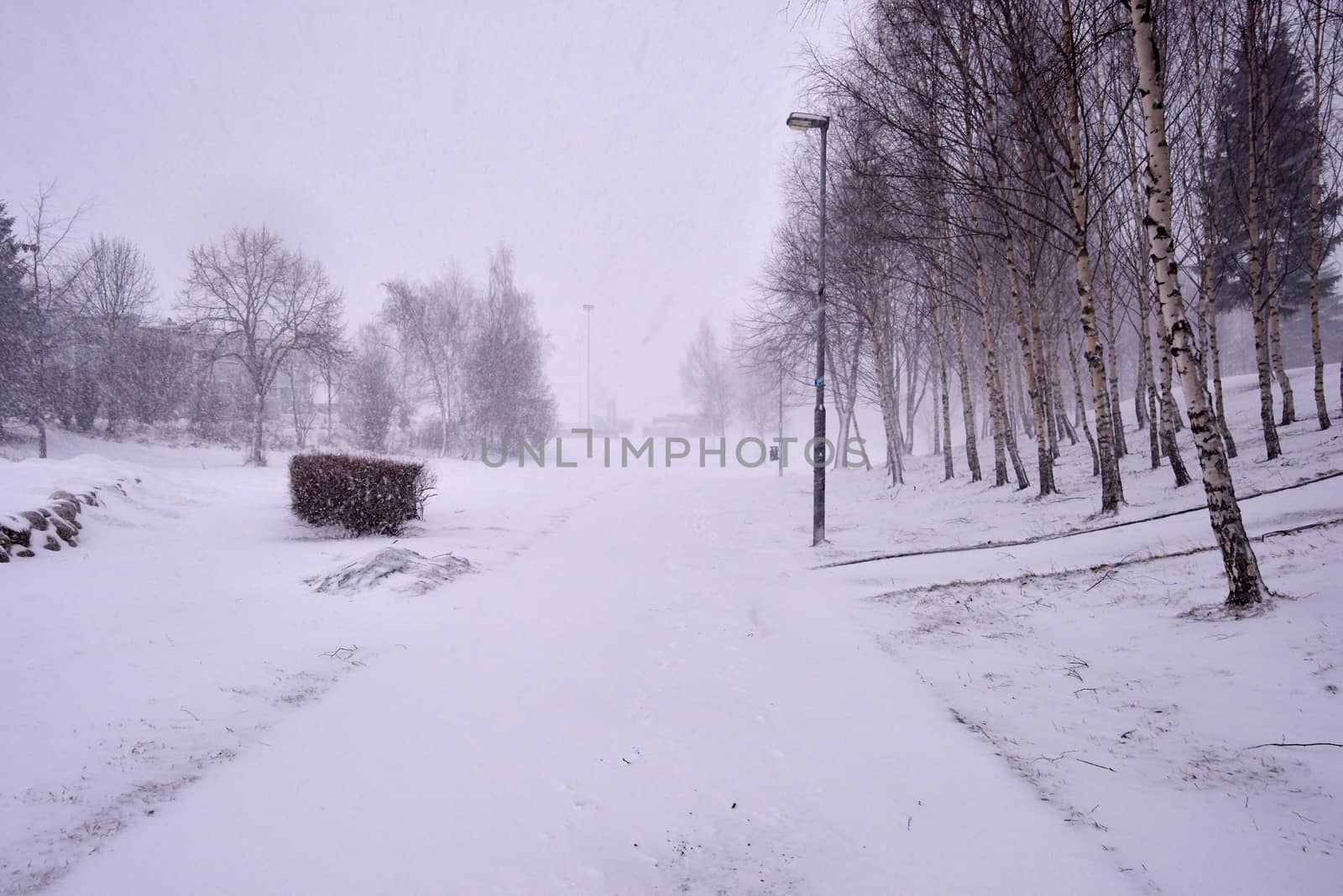Snowing heavily in a Norwegian neighborhood covering the walkway